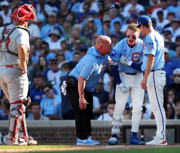 Chicago Cubs center fielder Pete Crow-Armstrong (4) reacts after being hit by a pitch in the seventh inning of a game against the St. Louis Cardinals at Wrigley Field in Chicago on Sept. 26, 2025. (Chris Sweda/Chicago Tribune)