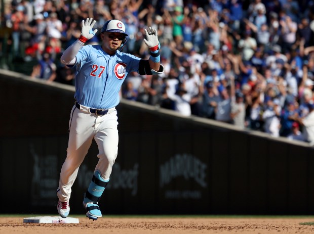 Chicago Cubs right fielder Seiya Suzuki celebrates as he rounds the bases after hitting a grand slam in the seventh inning of a game against the St. Louis Cardinals at Wrigley Field in Chicago on Sept. 26, 2025. (Chris Sweda/Chicago Tribune)