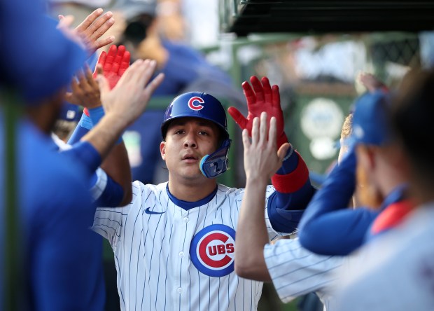 Chicago Cubs catcher Miguel Amaya (9) is congratulated by his teammates in the dugout after hitting a 2-run home run in the third inning of a game against the San Francisco Giants at Wrigley Field in Chicago on May 6, 2025. (Chris Sweda/Chicago Tribune)