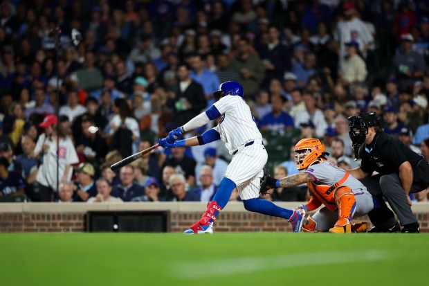 Chicago Cubs first base Carlos Santana (41) hits a two RBI double during the first inning against the New York Mets at Wrigley Field Tuesday Sept. 23, 2025, in Chicago. (Armando L. Sanchez/Chicago Tribune)