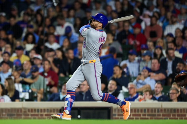 New York Mets outfielder Brandon Nimmo (9) hits a three-run homer during the fifth inning against the Chicago Cubs at Wrigley Field Tuesday Sept. 23, 2025, in Chicago. (Armando L. Sanchez/Chicago Tribune)