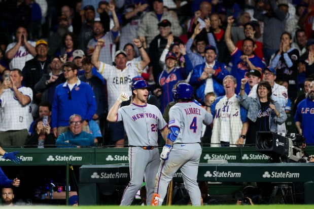 New York Mets first base Pete Alonso (20) celebrates with New York Mets catcher Francisco Alvarez (4) after Alvarez hit a two-run homer during the eighth inning against the Chicago Cubs at Wrigley Field Tuesday Sept. 23, 2025, in Chicago. (Armando L. Sanchez/Chicago Tribune)