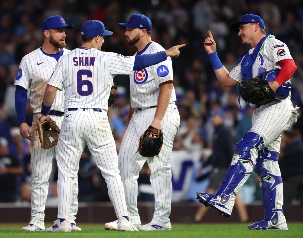 Chicago Cubs third base Matt Shaw (6) celebrates with catcher Reese McGuire (right) after a victory over the New York Mets at Wrigley Field in Chicago on Sept. 24, 2025. (Chris Sweda/Chicago Tribune)