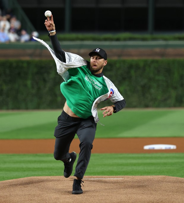 Former Chicago Cubs player Ben Zobrist throws out a ceremonial first pitch before a game between the Cubs and the New York Mets at Wrigley Field in Chicago on Sept. 24, 2025. (Chris Sweda/Chicago Tribune)