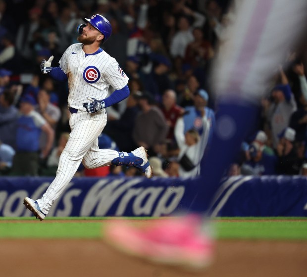 Chicago Cubs first baseman Michael Busch rounds the bases after hitting a two-run home run in the sixth inning of a game against the New York Mets at Wrigley Field in Chicago on Sept. 24, 2025. (Chris Sweda/Chicago Tribune)
