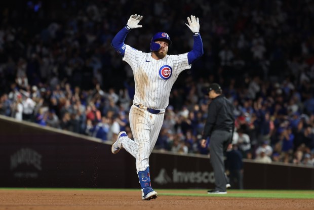 Chicago Cubs first baseman Michael Busch celebrates as he rounds the bases after hitting a two-run home run in the sixth inning of a game against the New York Mets at Wrigley Field in Chicago on Sept. 24, 2025. (Chris Sweda/Chicago Tribune)