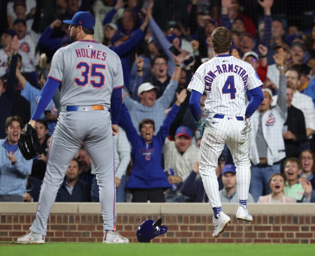 Chicago Cubs center fielder Pete Crow-Armstrong (4) celebrates after scoring on a wild pitch by New York Mets relief pitcher Clay Holmes (35) in the fifth inning of a game at Wrigley Field in Chicago on Sept. 24, 2025. (Chris Sweda/Chicago Tribune)