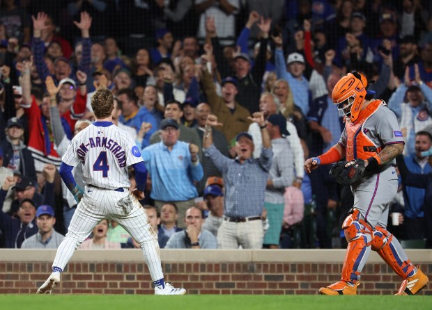 Chicago Cubs center fielder Pete Crow-Armstrong (4) celebrates after scoring on a wild pitch in the fifth inning of a game against the New York Mets at Wrigley Field in Chicago on Sept. 24, 2025. (Chris Sweda/Chicago Tribune)