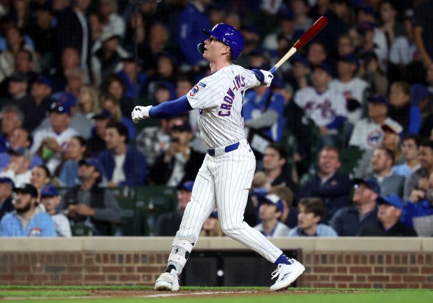 Chicago Cubs center fielder Pete Crow-Armstrong (4) drives in a run on a sacrifice fly in the third inning of a game against the New York Mets at Wrigley Field in Chicago on Sept. 24, 2025. (Chris Sweda/Chicago Tribune)