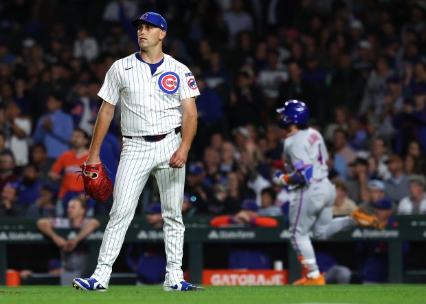 Chicago Cubs starting pitcher Matthew Boyd stands on the infield as New York Mets catcher Francisco Alvarez (right) rounds the bases after Alvarez hit a 2-run home run in the fifth inning of a game at Wrigley Field in Chicago on Sept. 24, 2025. (Chris Sweda/Chicago Tribune)