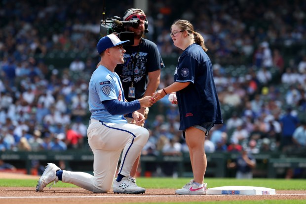 Chicago Cubs third baseman Matt Shaw says hello to a fan as Cubs starters sign autographs for season ticket holders before a game against the Tampa Bay Rays at Wrigley Field in Chicago on Sept. 12, 2025. (Chris Sweda/Chicago Tribune)