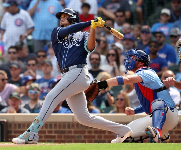 Tampa Bay Rays designated hitter Christopher Morel hits a 3-run home run in the first inning of a game against the Chicago Cubs at Wrigley Field in Chicago on Sept. 12, 2025. (Chris Sweda/Chicago Tribune)