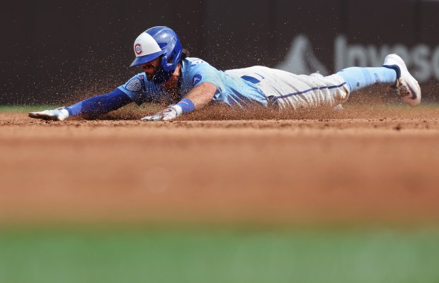 Chicago Cubs shortstop Dansby Swanson slides into second base on a run-scoring double in the second inning of a game against the Tampa Bay Rays at Wrigley Field in Chicago on Sept. 12, 2025. (Chris Sweda/Chicago Tribune)