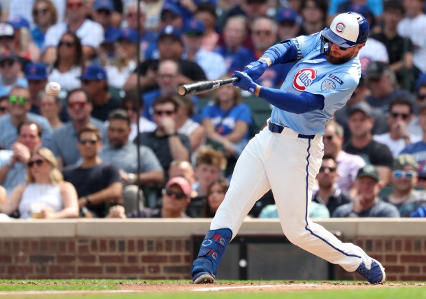 Chicago Cubs first baseman Michael Busch drives in a run on a single in the second inning of a game against the Tampa Bay Rays at Wrigley Field in Chicago on Sept. 12, 2025. (Chris Sweda/Chicago Tribune)
