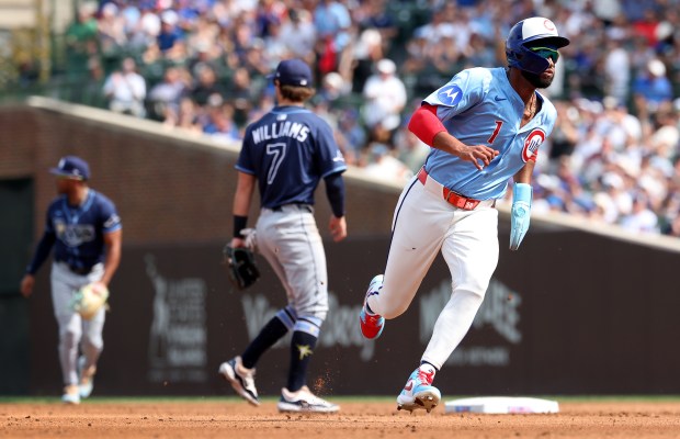 Chicago Cubs right fielder Willi Castro advances to third base on a run-scoring single by teammate Michael Busch in the second inning of a game against the Tampa Bay Rays at Wrigley Field in Chicago on Sept. 12, 2025. (Chris Sweda/Chicago Tribune)