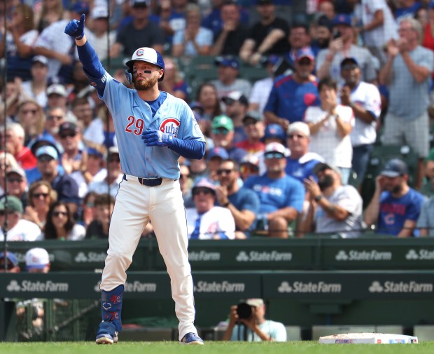 Chicago Cubs first baseman Michael Busch celebrates at first base after driving in a run on a single in the second inning of a game against the Tampa Bay Rays at Wrigley Field in Chicago on Sept. 12, 2025. (Chris Sweda/Chicago Tribune)