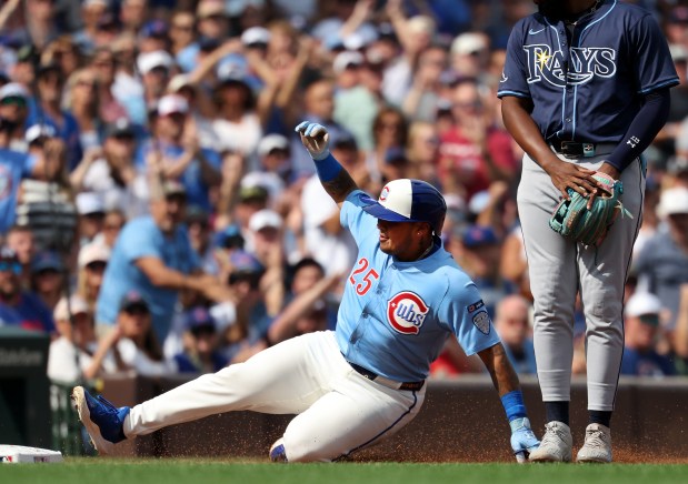 Chicago Cubs designated hitter Moisés Ballesteros slides into third base on a run-scoring triple in the third inning of a game against the Tampa Bay Rays at Wrigley Field in Chicago on Sept. 12, 2025. (Chris Sweda/Chicago Tribune)
