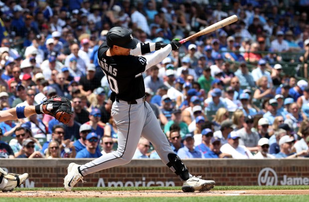 Chicago White Sox third baseman Miguel Vargas (20) hits a two-run home run in the first inning of a game against the Chicago Cubs at Wrigley Field in Chicago on May 16, 2025. (Chris Sweda/Chicago Tribune)