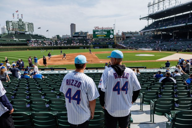 Fans wear Cubs first baseman Anthony Rizzo jerseys before the Cubs play the Tampa Bay Rays at Wrigley Field after the Cubs announced he would retire with the organization he helped lead to a World Series title in 2016 and become an ambassador for the team Saturday Sept. 13, 2025, in Chicago. (Armando L. Sanchez/Chicago Tribune)