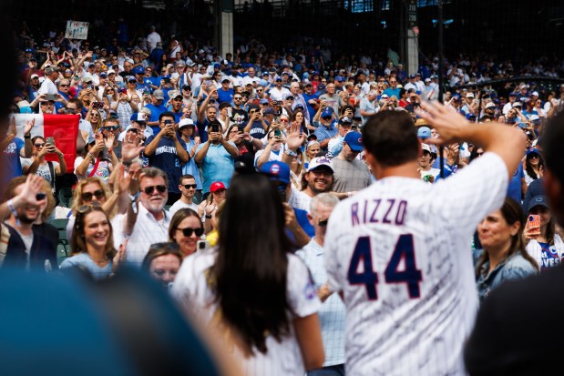Former Cubs first baseman Anthony Rizzo waves to fans at Wrigley Field after the Cubs announced he would retire with the organization he helped lead to a World Series title in 2016 and become an ambassador for the team Saturday Sept. 13, 2025, in Chicago. (Armando L. Sanchez/Chicago Tribune)