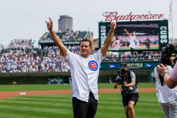 Prior to throwing out the first pitch former Cubs first baseman Anthony Rizzo waves to fans before the Cubs play the Tampa Bay Rays at Wrigley Field after the Cubs announced he would retire and become an ambassador for the team he helped lead to a World Series in 2016 Saturday Sept. 13, 2025, in Chicago. (Armando L. Sanchez/Chicago Tribune)