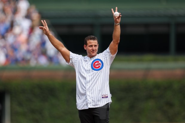 Prior to throwing out the first pitch former Cubs first baseman Anthony Rizzo waves to fans before the Cubs play the Tampa Bay Rays at Wrigley Field after the Cubs announced he would retire and become an ambassador for the team he helped lead to a World Series in 2016 Saturday Sept. 13, 2025, in Chicago. (Armando L. Sanchez/Chicago Tribune)