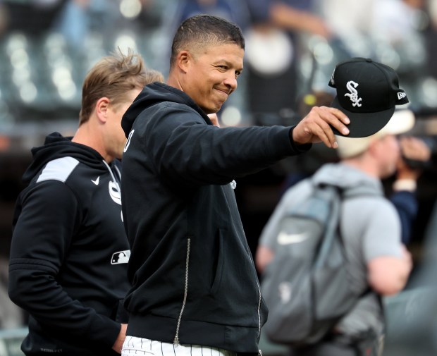 Chicago White Sox manager Will Venable waves toward the New York Yankees dugout while walking out for the national anthem before a game at Rate Field in Chicago on Aug. 30, 2025. (Chris Sweda/Chicago Tribune)