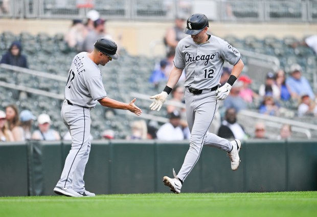 Colson Montgomery #12 of the Chicago White Sox celebrates with third base coach Justin Jirschele #17 while rounding the bases after hitting a solo home run against the Minnesota Twins in the second inning of the game at Target Field on Sept. 1, 2025 in Minneapolis, Minnesota. (Photo by Stephen Maturen/Getty Images)