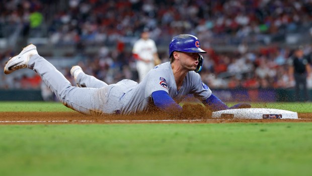 Nico Hoerner #2 of the Chicago Cubs steals third base in the fifth inning against the Atlanta Braves at Truist Park on Sept. 10, 2025 in Atlanta, Georgia. (Photo by Todd Kirkland/Getty Images)