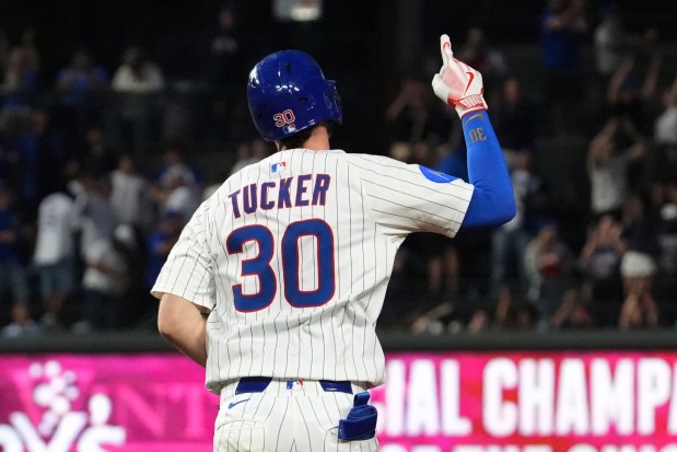 Chicago Cubs' Kyle Tucker celebrates as he rounds the bases after hitting a three-run home run during the third inning of a baseball game against the Atlanta Braves in Chicago, Tuesday, Sept. 2, 2025. (AP Photo/Nam Y. Huh)