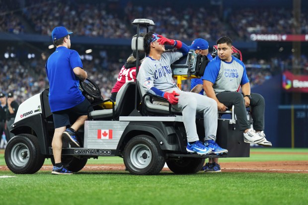 Cubs catcher Miguel Amaya leaves the game with a left leg injury during the eighth inning against the Blue Jays on Aug. 13, 2025, in Toronto. (Nathan Denette/The Canadian Press via AP)