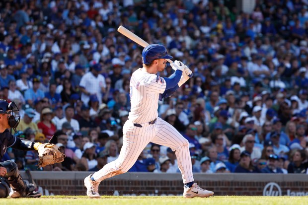 Cubs second baseman Nico Hoerner hits a two-run double in the seventh inning against the Rays on Sept. 14, 2025, at Wrigley Field. (Sage Zipeto/Getty Images)