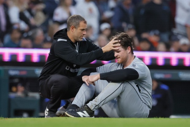 White Sox starter Shane Smith is checked by a trainer after colliding with catcher Kyle Teel while chasing a wild pitch in the fourth inning against the Tigers on Sept. 5, 2025, in Detroit. Smith remained in the game. (Duane Burleson/Getty Images)