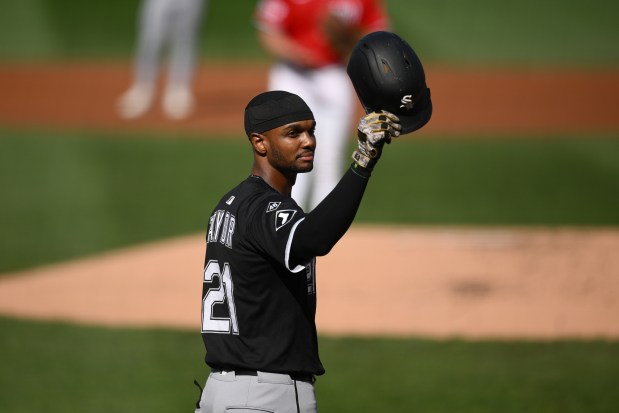 Chicago White Sox's Michael A. Taylor doffs his batting helmet to the crowd during the second inning after it was announced Sunday will be his final MLB baseball game, against the Washington Nationals, Sunday, Sept. 28, 2025, in Washington. (AP Photo/Nick Wass)