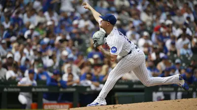 Aug 18, 2025; Chicago, Illinois, USA; Chicago Cubs pitcher Cade Horton (22) delivers against the Milwaukee Brewers during the third inning at Wrigley Field.