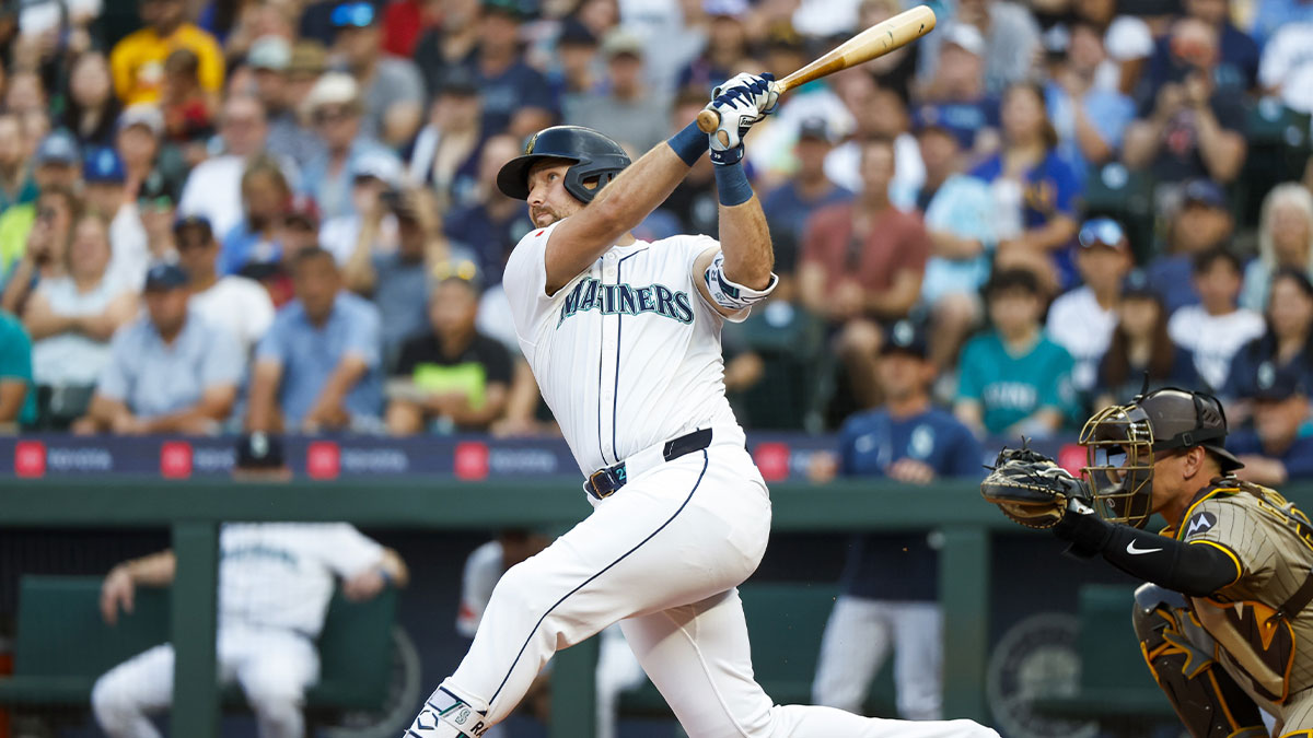 Aug 25, 2025; Seattle, Washington, USA; Seattle Mariners catcher Cal Raleigh (29) hits a solo-home run against the San Diego Padres during the first inning at T-Mobile Park. The home run is the 50th of the season for Raleigh.