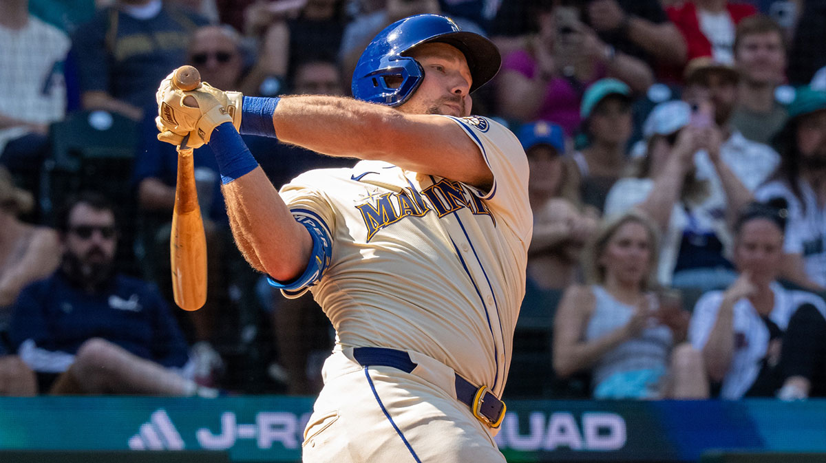 Seattle Mariners catcher Cal Raleigh (29) hits a single during the eighth inning against the Athletics at T-Mobile Park.