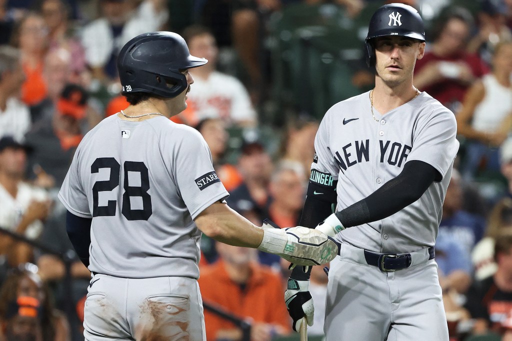 Austin Wells (28) celebrates with Cody Bellinger (35) after scoring a run during the seventh inning of the Yankees' 7-0 blowout win over the Orioles on Sept. 18, 2025.