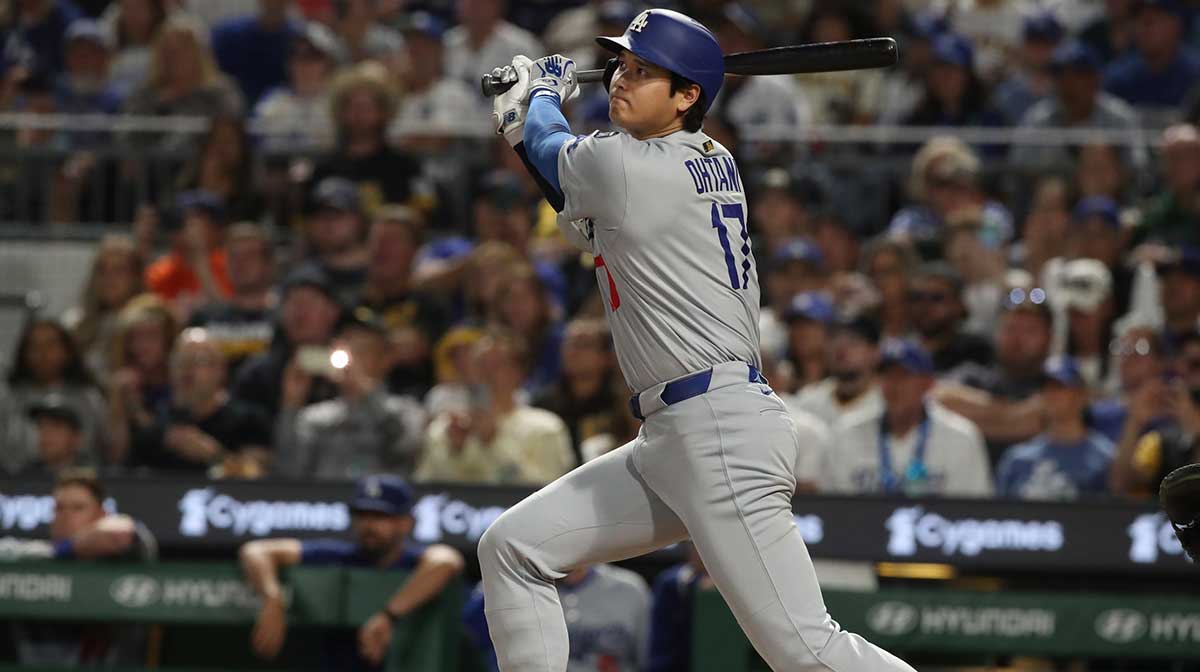 Los Angeles Dodgers two-way player Shohei Ohtani (17) hits a double against the Pittsburgh Pirates during the seventh inning at PNC Park.