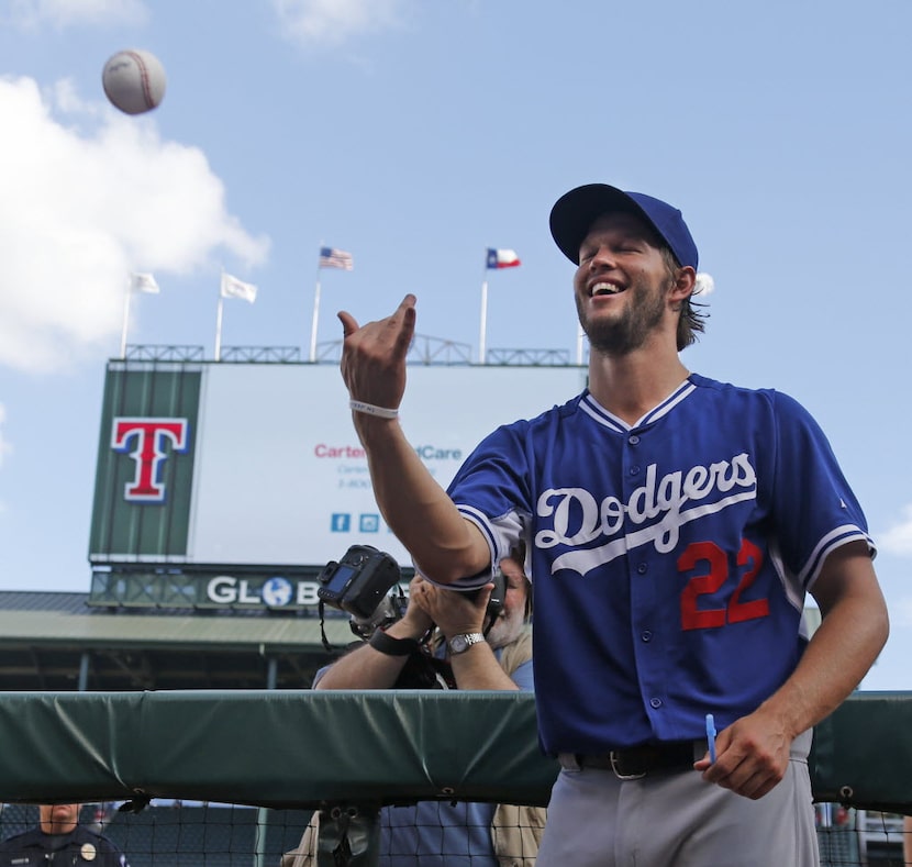 Los Angeles Dodgers pitcher Clayton Kershaw signs autographs before the Los Angeles Dodgers...