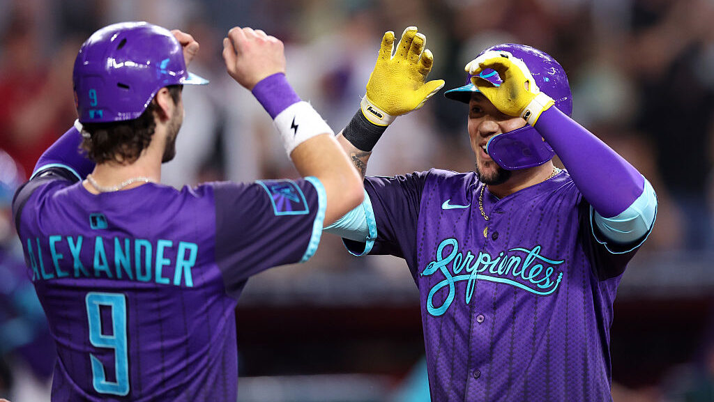 Ildemaro Vargas #6 of the Arizona Diamondbacks celebrates his three run home run with Blaze Alexand...