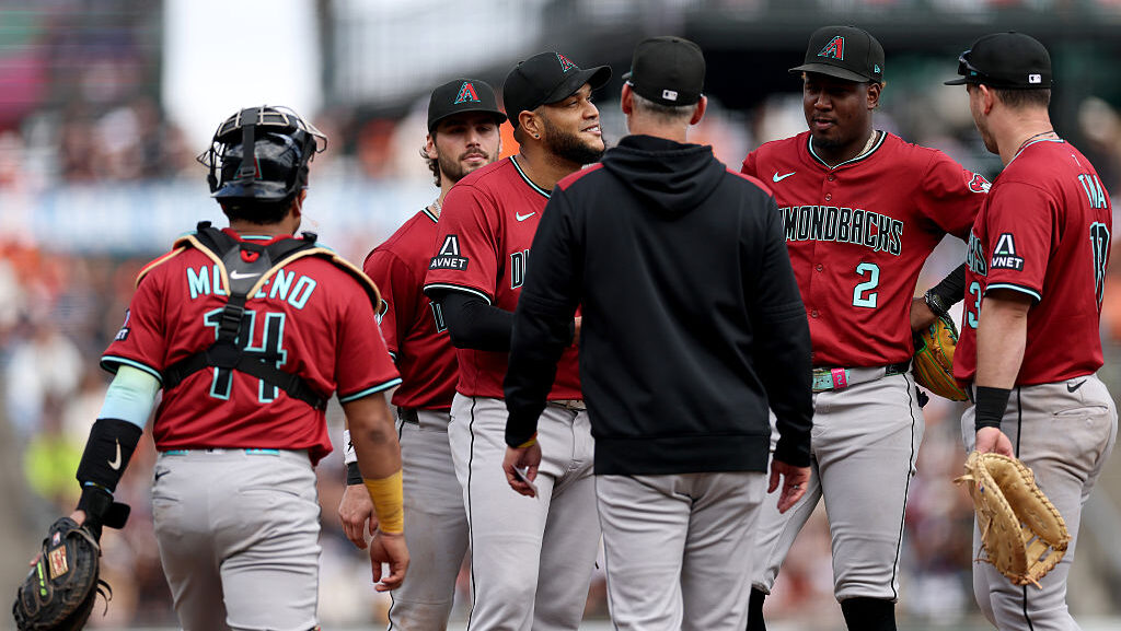 Manager Torey Lovullo takes out Eduardo Rodriguez #57 of the Arizona Diamondbacks...