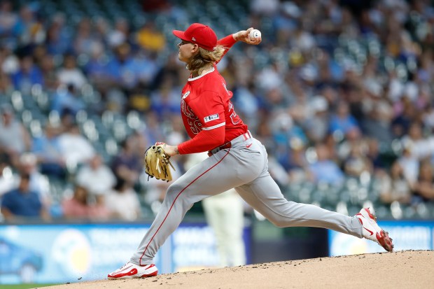 Angels starting pitcher Caden Dana throws to the plate during...