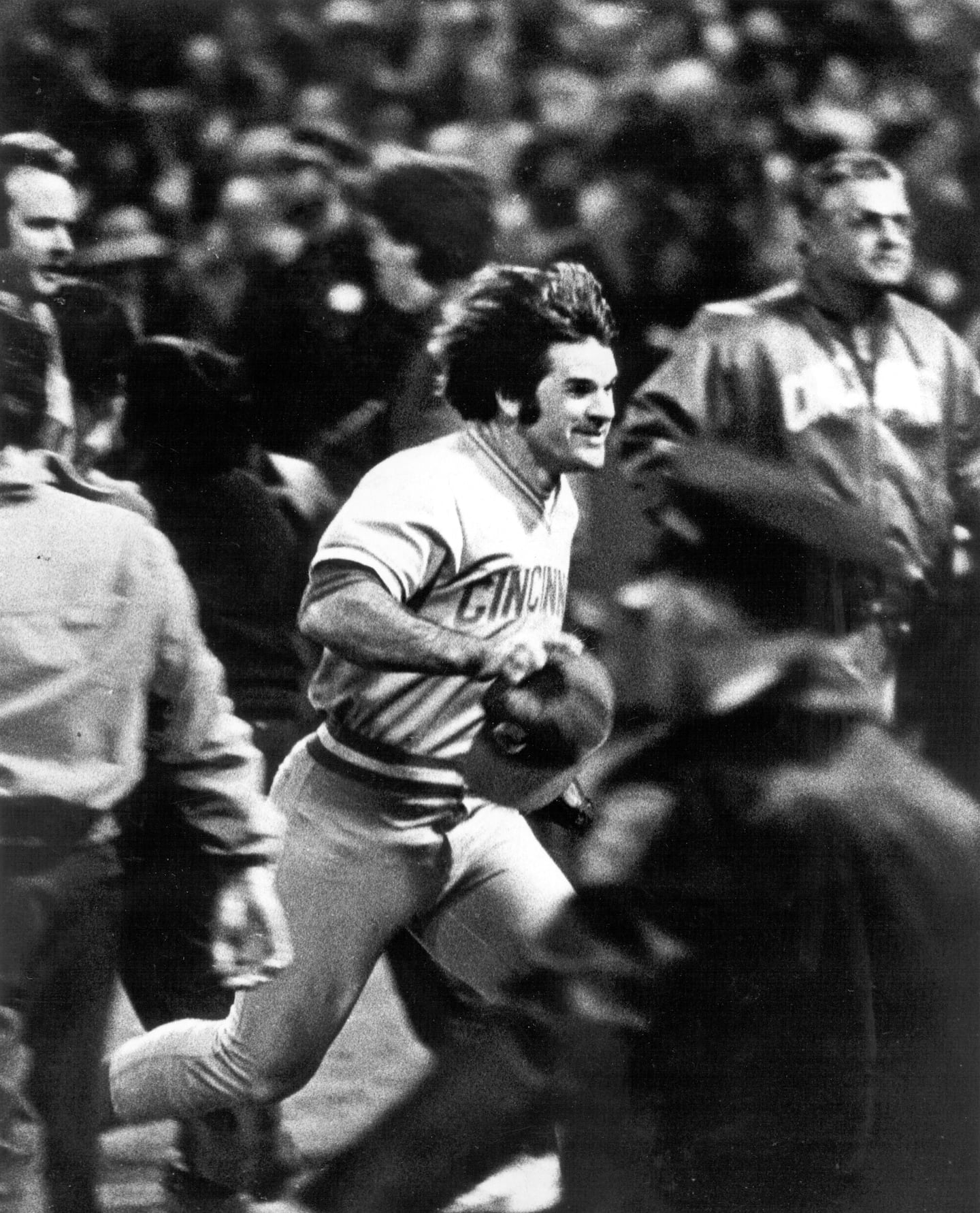 Pete Rose ran across the field of Fenway Park after the Reds won Game 7.