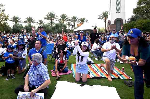 Dodger fans gather at the Ontario Town Center during the...