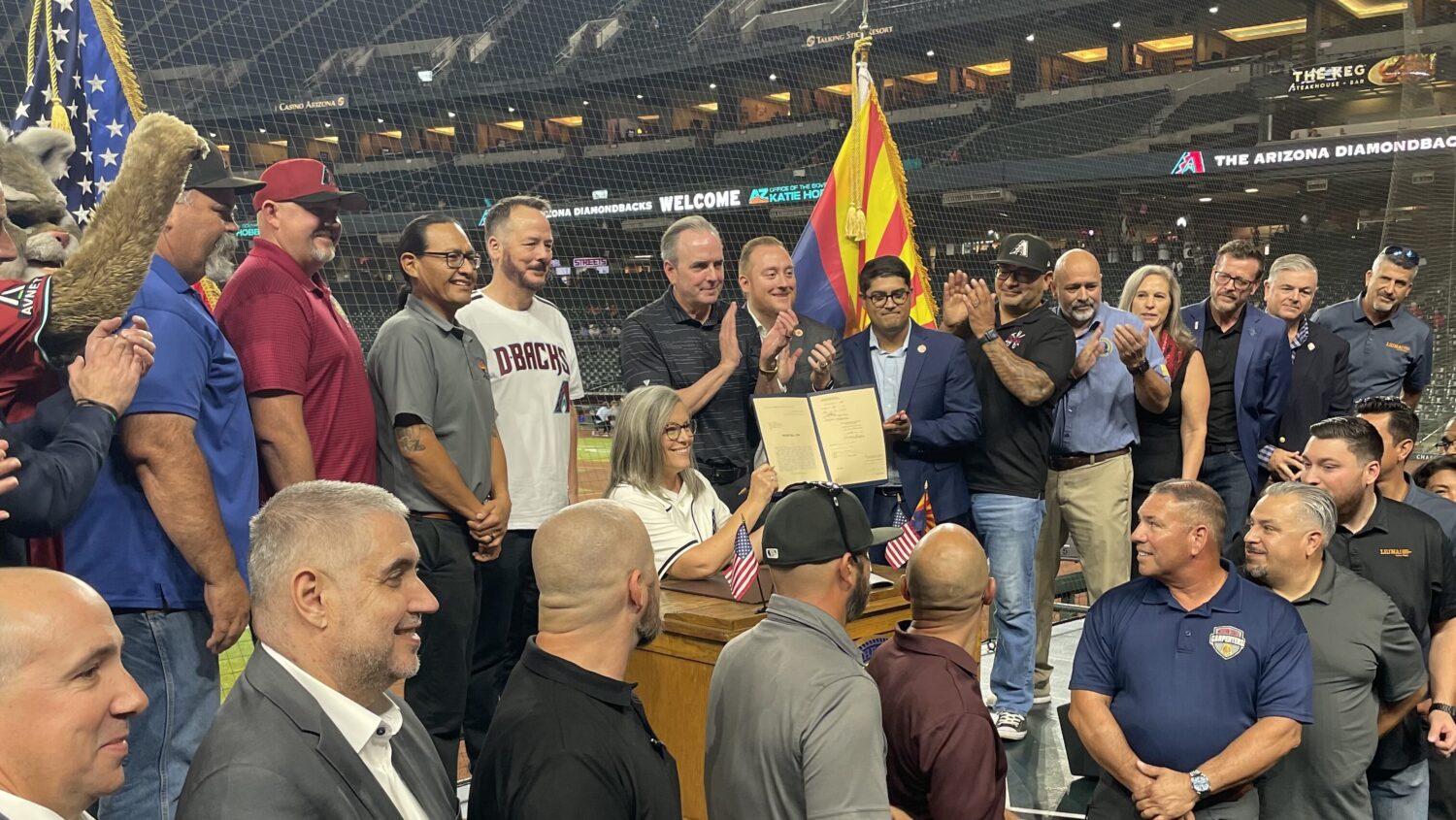 Arizona Gov. Katie Hobbs signs Chase Field bill with Diamondbacks CEO Derrick Hall...