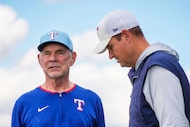 Texas Rangers manager Bruce Bochy (left) talks with president of baseball operations Chris...