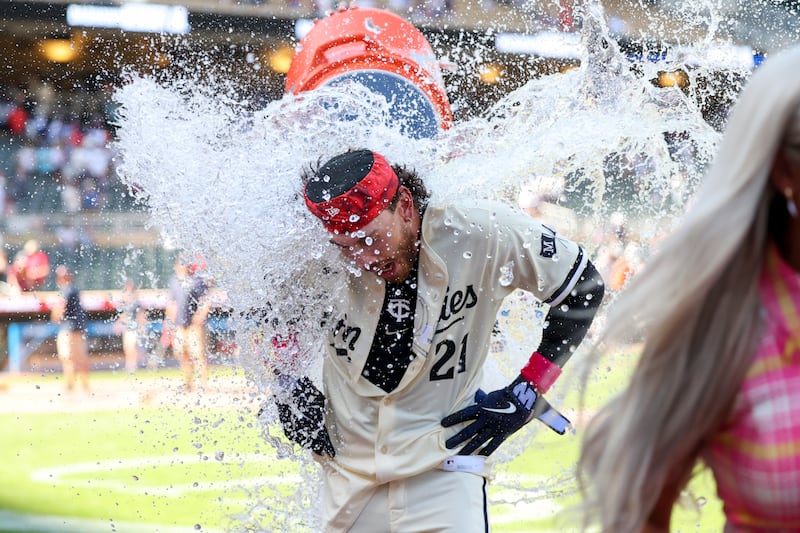 Minnesota Twins' DaShawn Keirsey Jr. is doused after hitting the winning walkoff single in a game against the San Francisco Giants, Sunday, May 11, 2025, in Minneapolis.