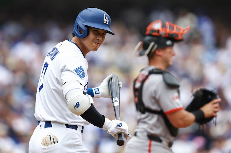 Photo of a baseball player getting ready to bat.