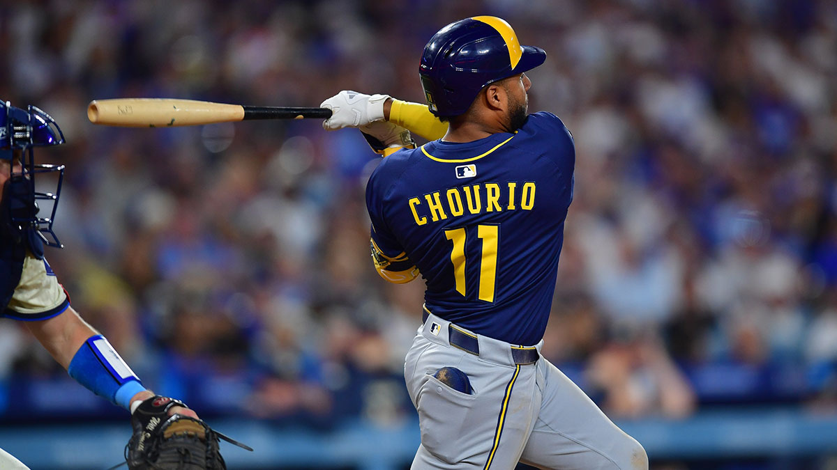 Milwaukee Brewers right fielder Jackson Chourio (11) hits a single against the Los Angeles Dodgers during the seventh inning at Dodger Stadium.